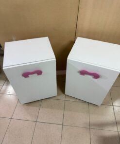 A white children's study desk with pink handles, featuring a foldable