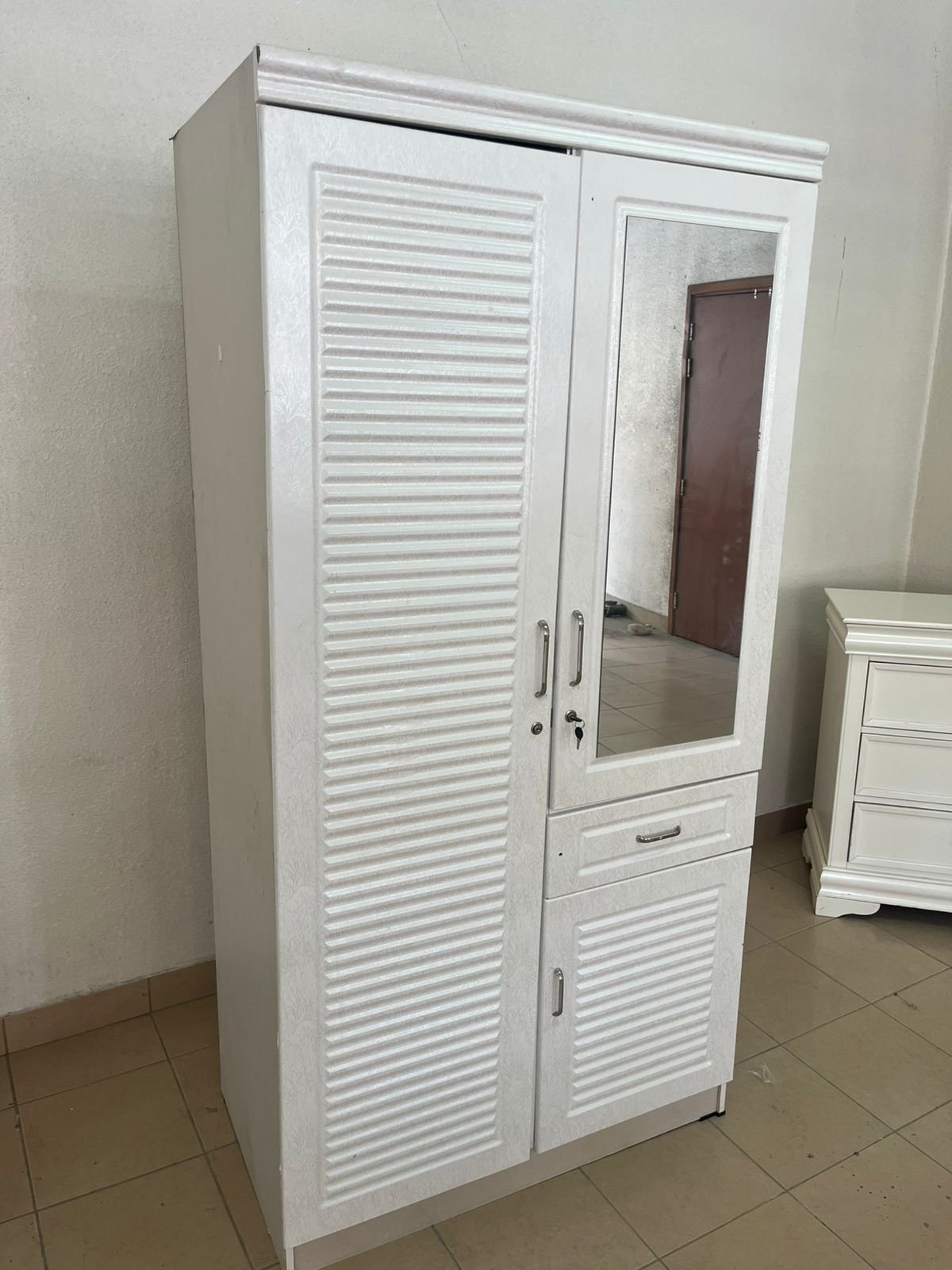 White two-door wardrobe with mirror and drawer