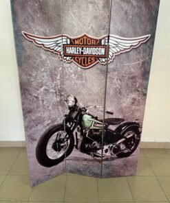 An ornate room partition bearing the logo and design of the classic Harley-Davidson motorcycle.