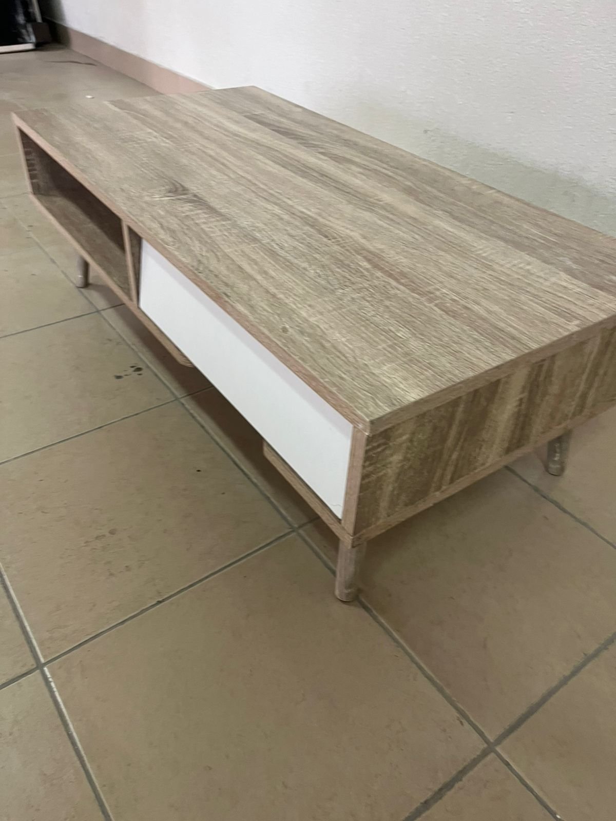 Modern design coffee table in light wood with a white drawer