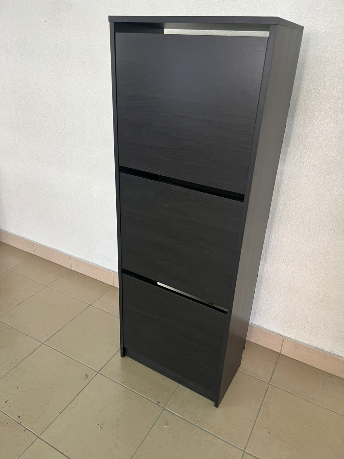 IKEA BISSA shoe cabinet with 3 compartments in black and brown.