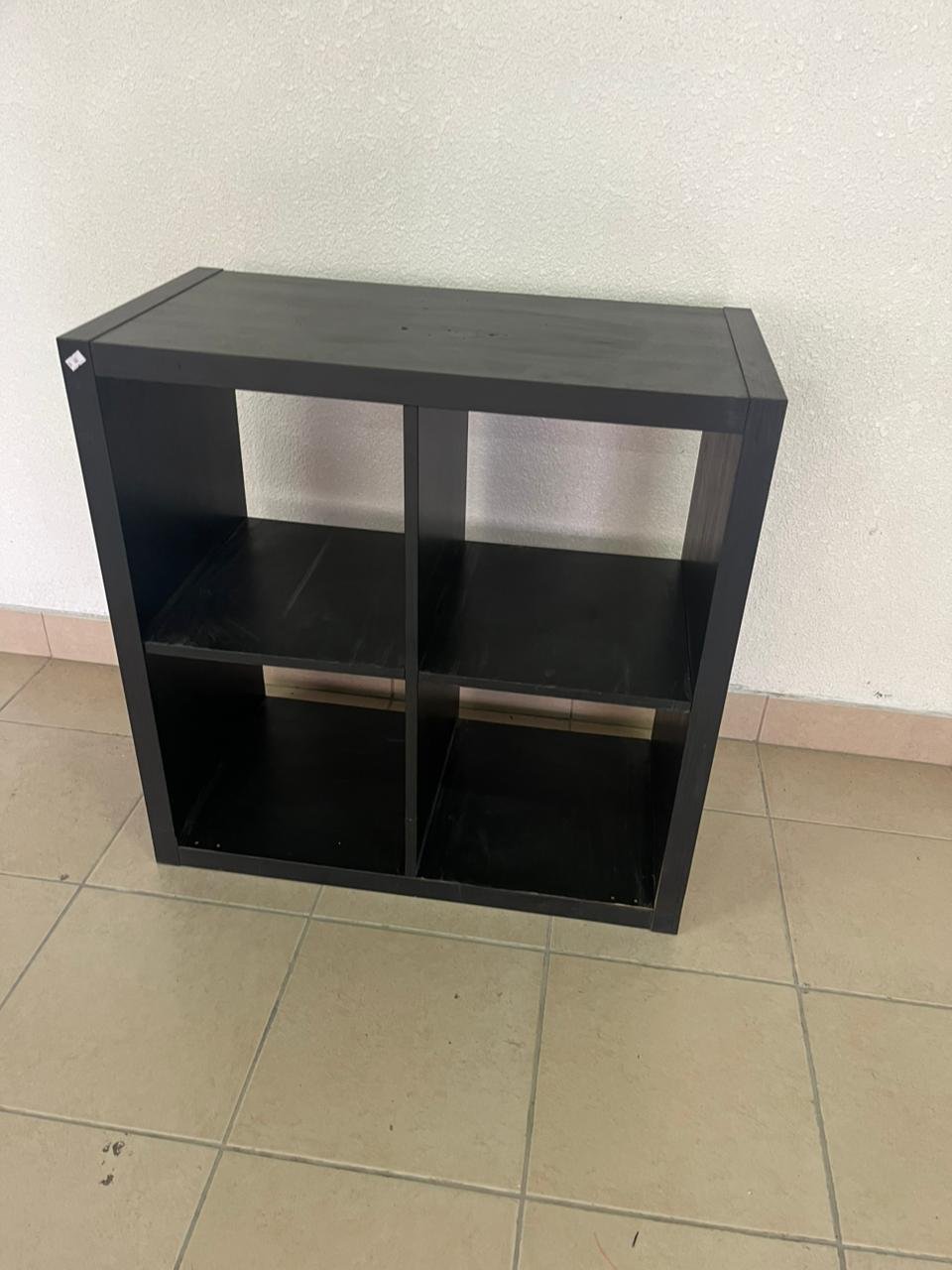 KALLAX shelving unit from IKEA in black and brown.