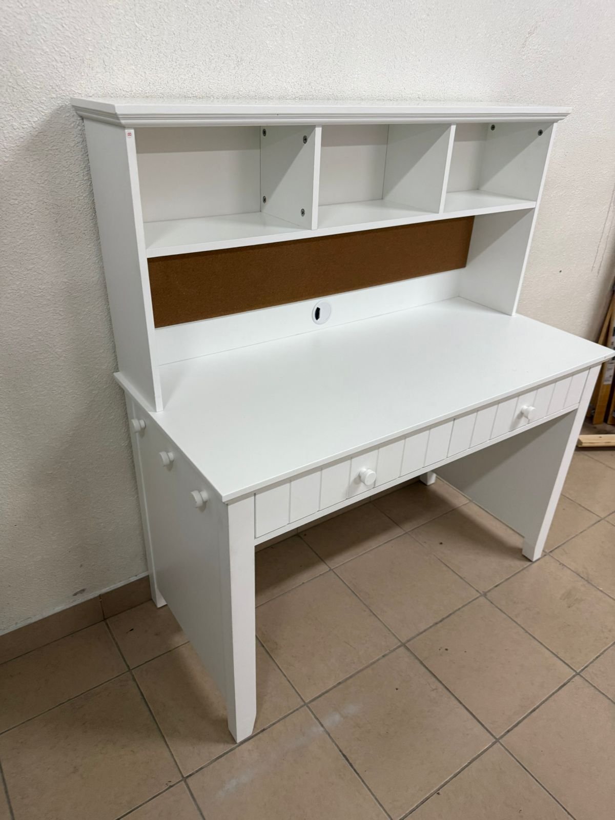 White desk and storage cabinet from Pottery Barn Kids.