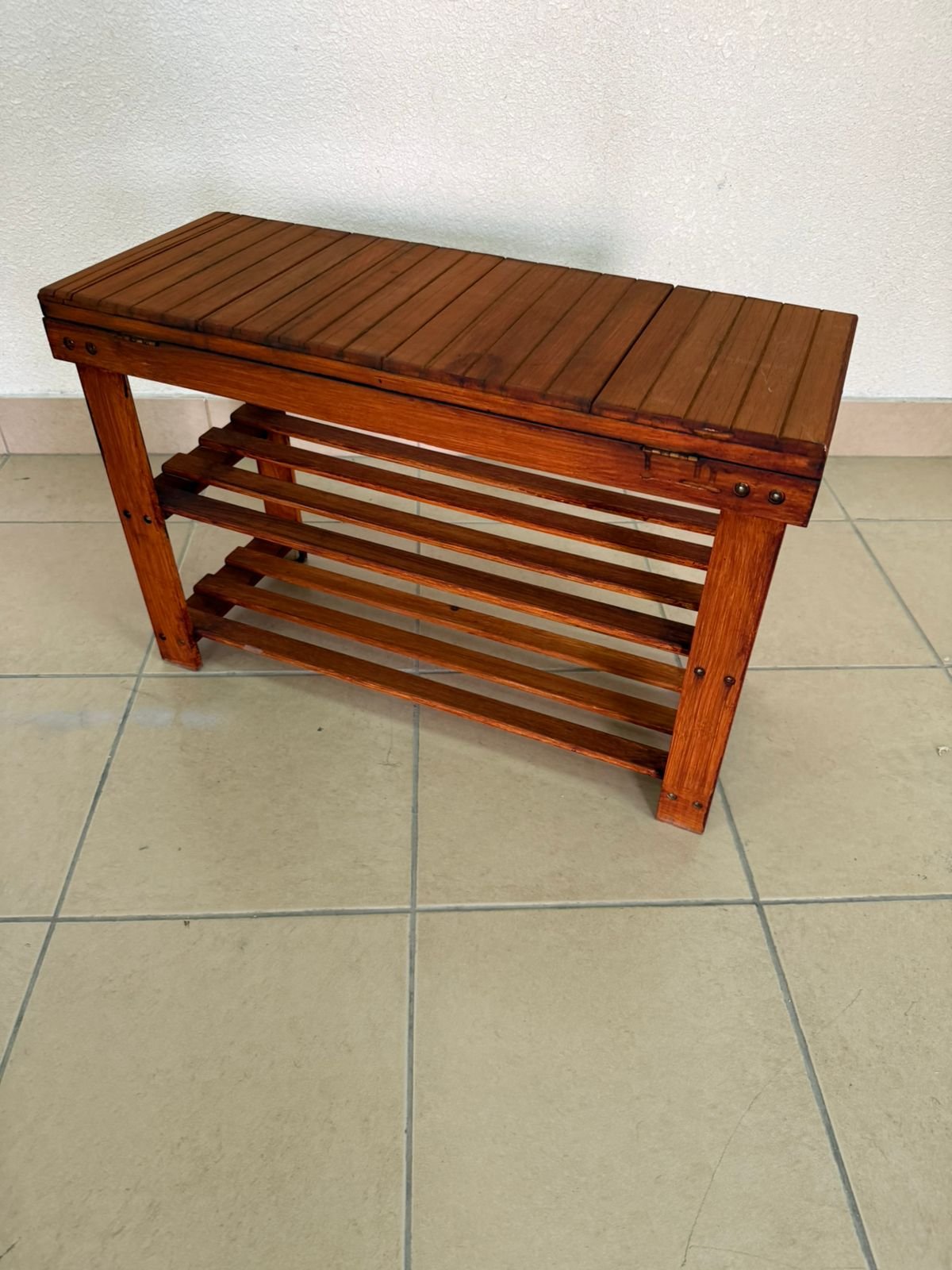 A modern wooden shoe storage bench