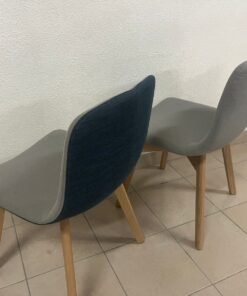 Two dining chairs with wooden legs