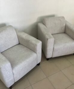 Two chairs with armrests