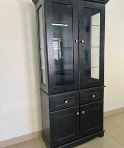 Storage cabinet with glass shelves, drawers, and wooden base cabinets.