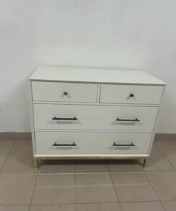 White drawer unit with black and gold handles from Home Centre