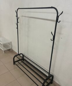 A metal clothes rack features an upper hanging rod and a lower shelf for shoes.
