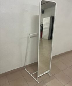 A standing mirror from IKEA, model KNAPPER.