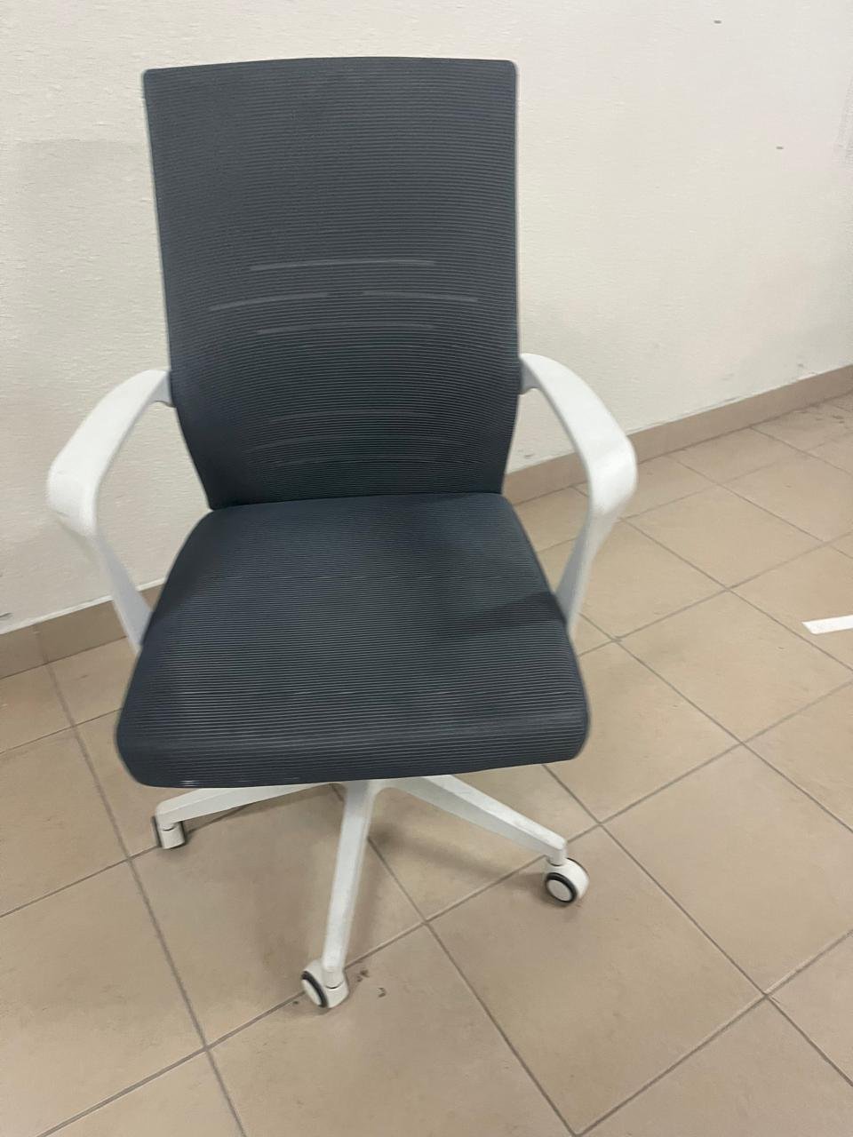 A gray office chair with a white frame and mesh back design. - Image 7