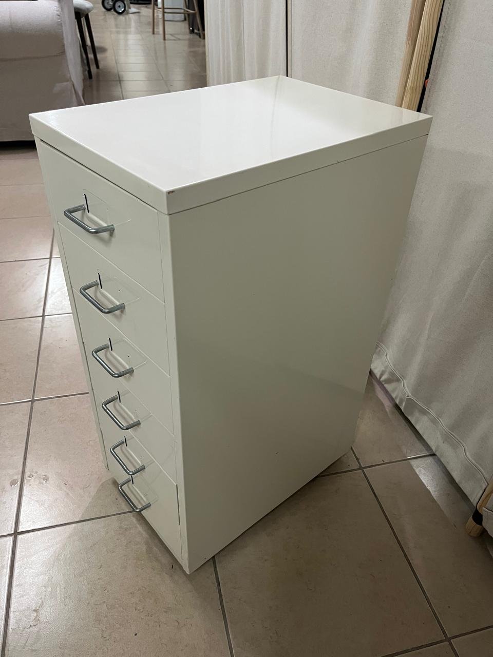The "Helmer" drawer unit from IKEA is white and equipped with wheels.