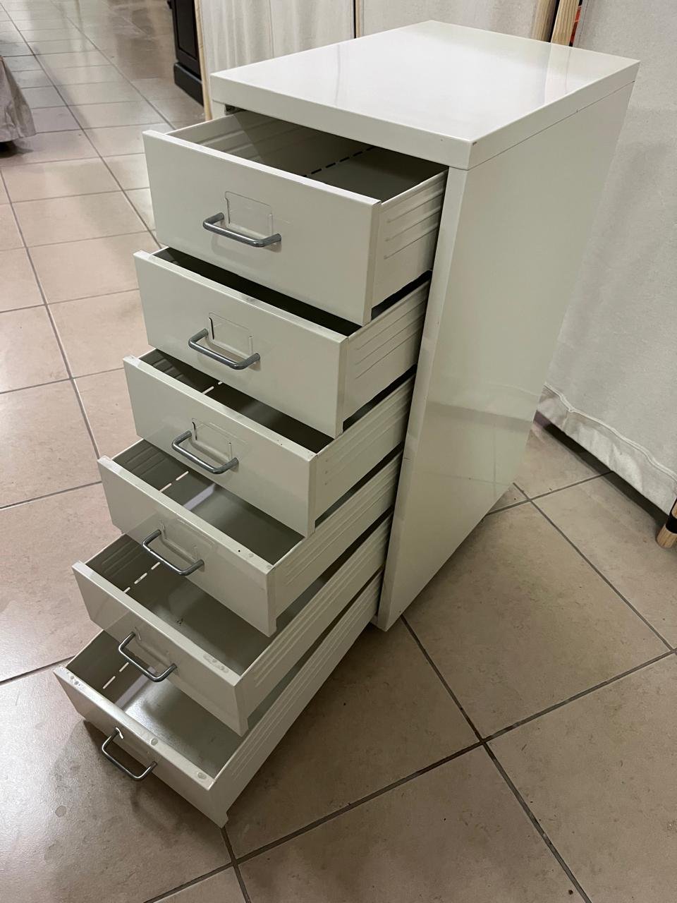 The "Helmer" drawer unit from IKEA is white and equipped with wheels. - Image 9