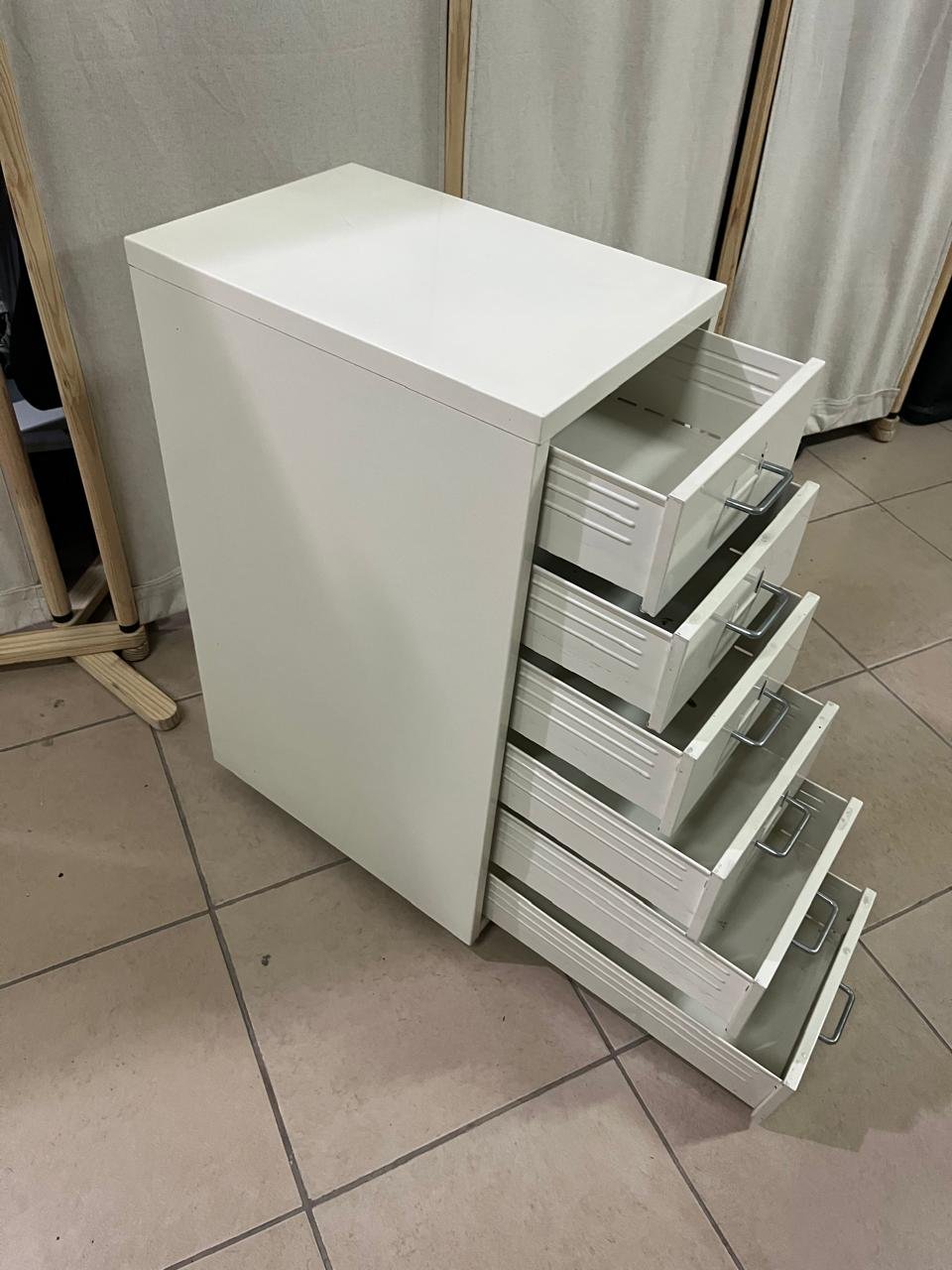 The "Helmer" drawer unit from IKEA is white and equipped with wheels. - Image 10