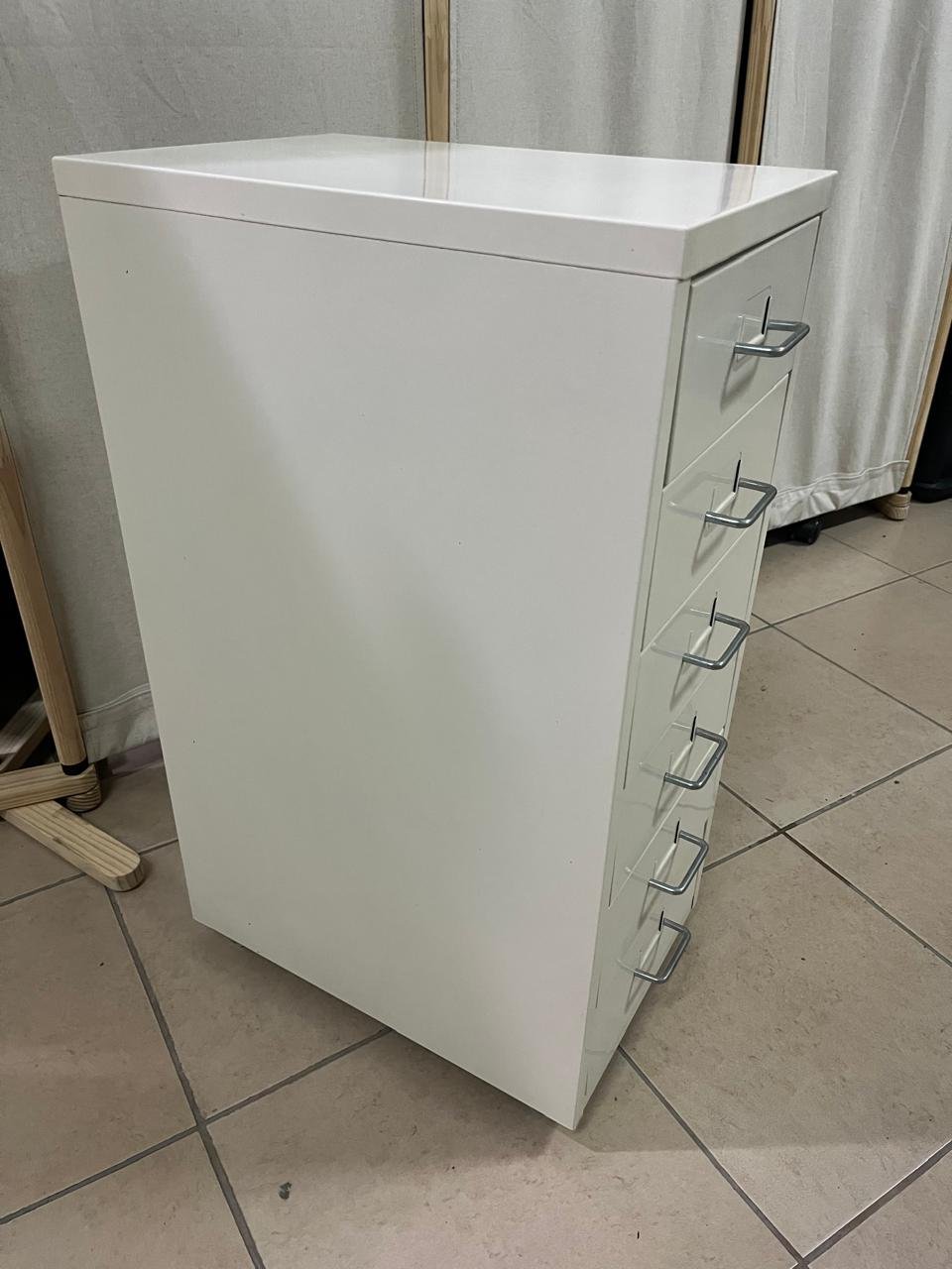 The "Helmer" drawer unit from IKEA is white and equipped with wheels. - Image 11