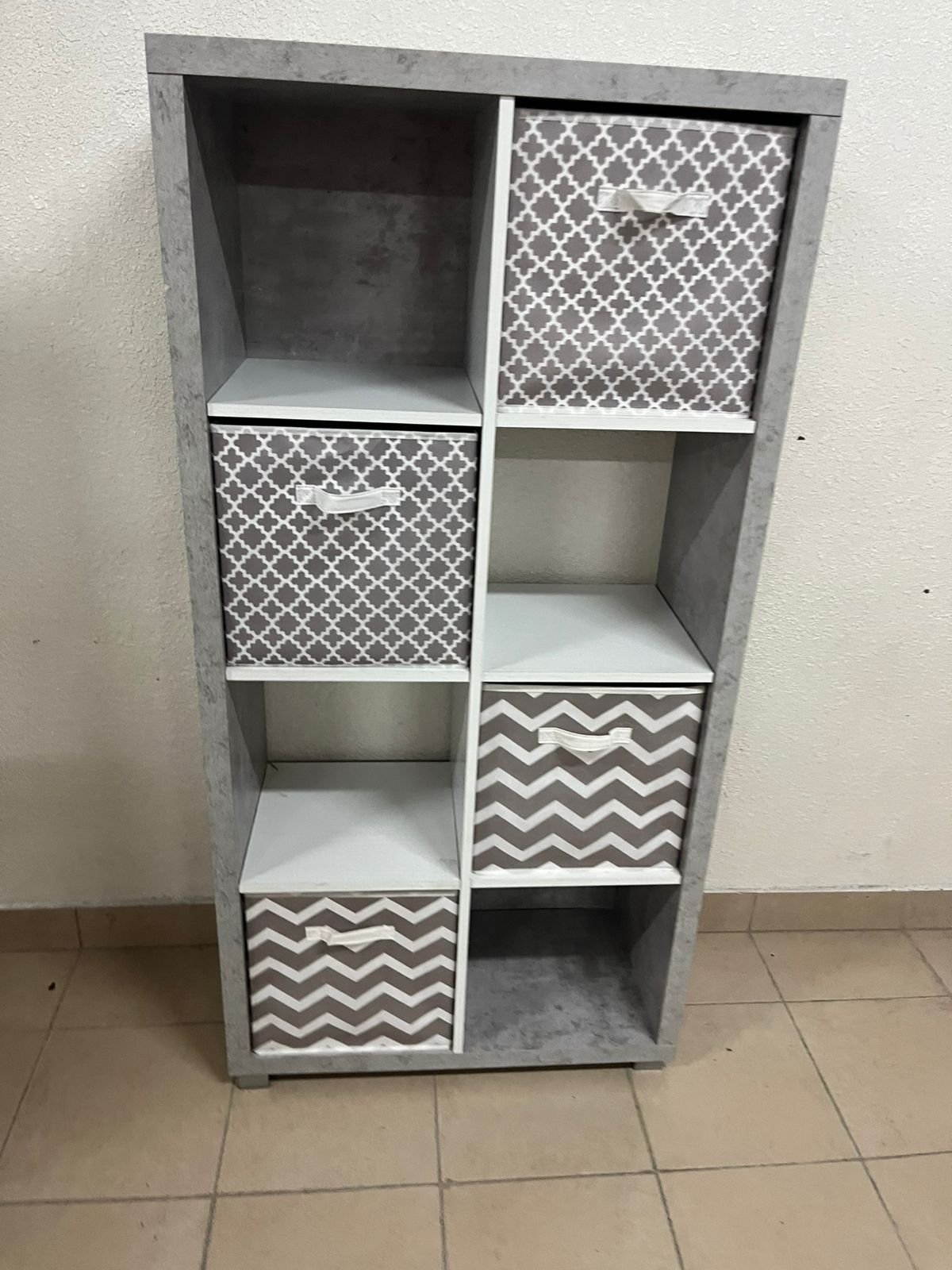This gray wooden storage unit from Home Source features fold-down fabric drawers. - Image 5