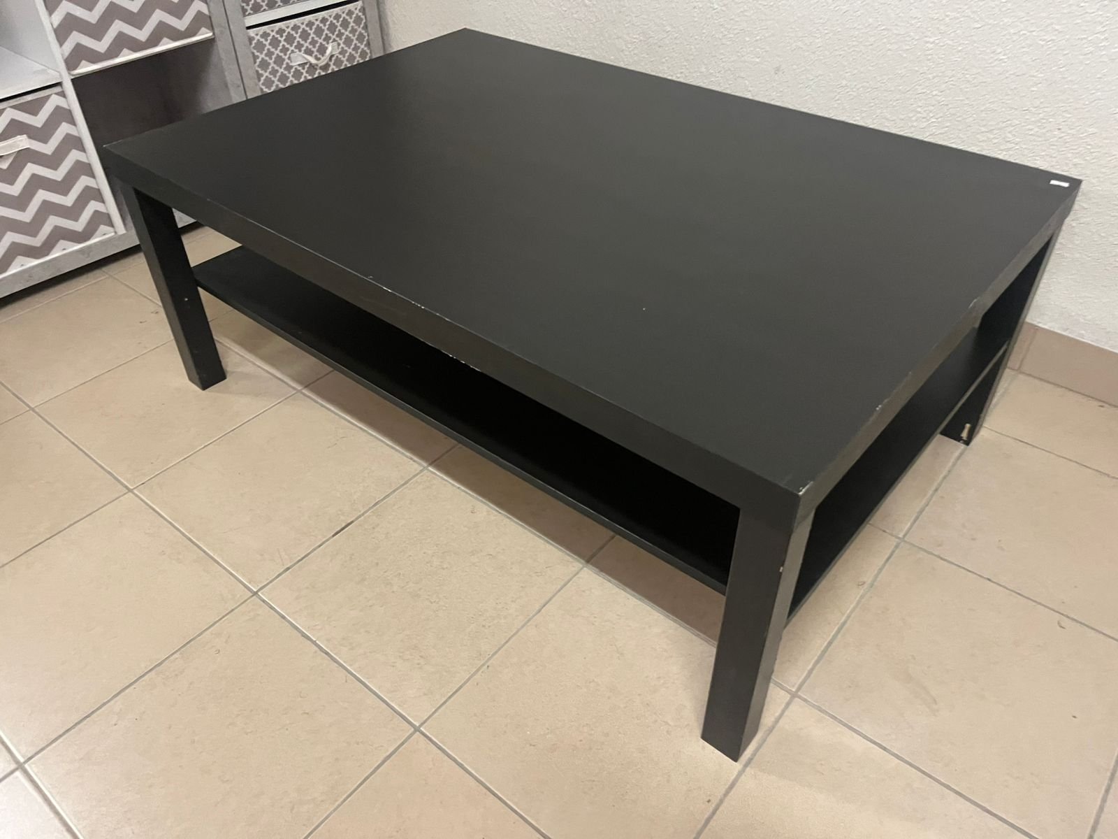This gray wooden storage unit from Home Source features fold-down fabric drawers. - Image 8