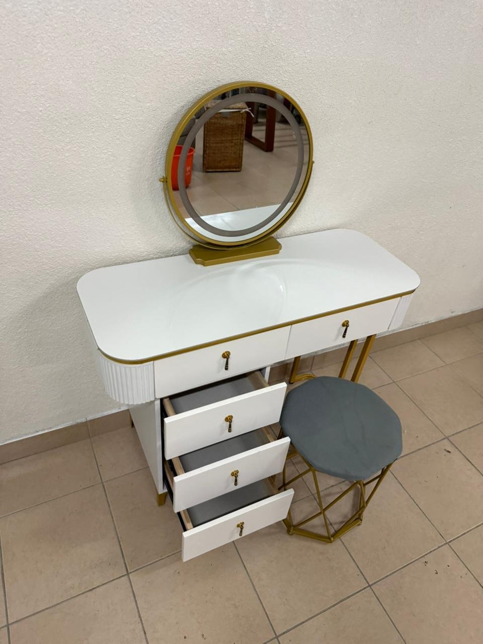 Modern white and gold makeup table with an elegant design