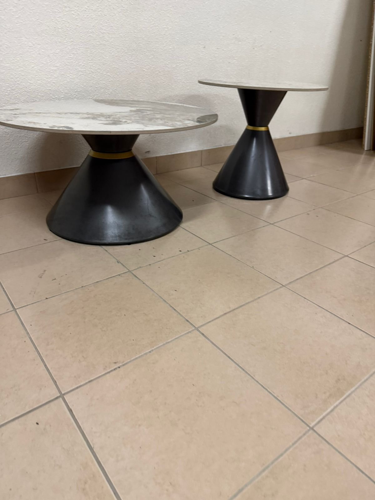 This is a round coffee table with a marble top and a black metal base in a modern design. - Image 2