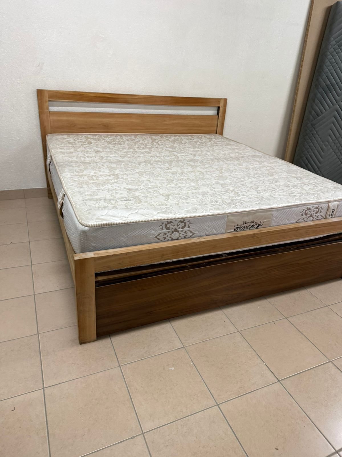 Natural wood bed with a modern design and built-in storage drawers - Image 10