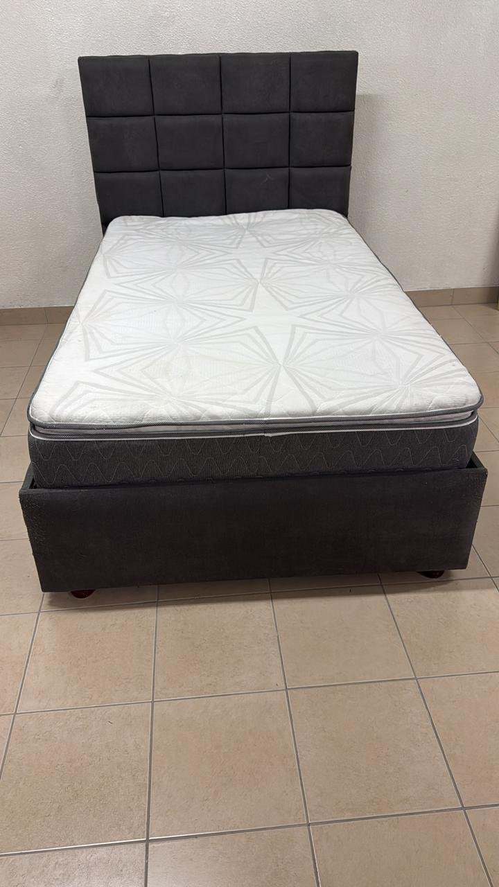 A modern single bed featuring a padded headboard - Image 2