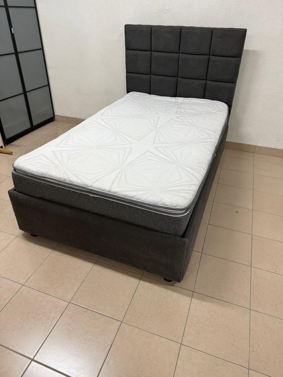 A modern single bed featuring a padded headboard - Image 3