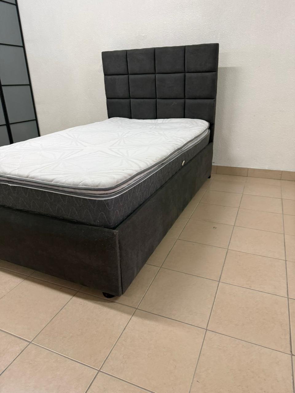 A modern single bed featuring a padded headboard - Image 5