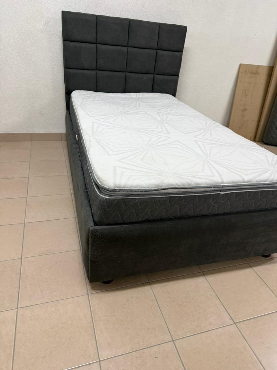 A modern single bed featuring a padded headboard - Image 6