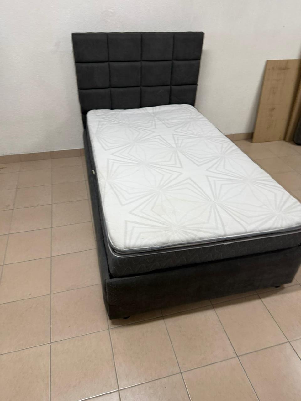 A modern single bed featuring a padded headboard - Image 7
