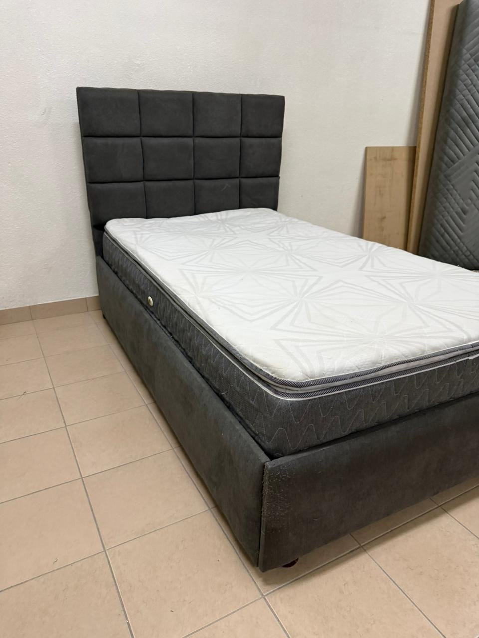 A modern single bed featuring a padded headboard - Image 8