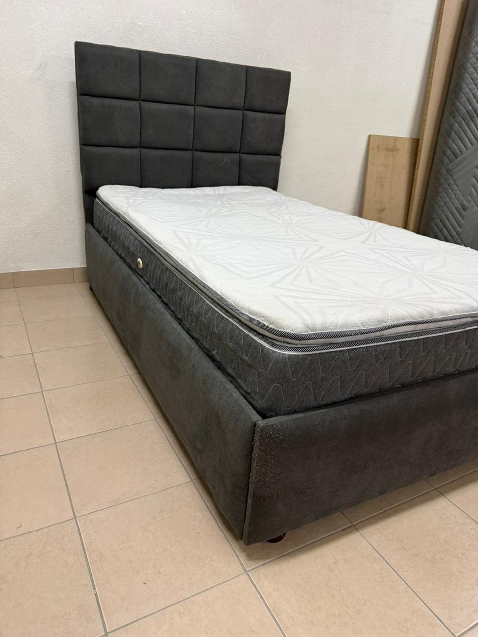 A modern single bed featuring a padded headboard - Image 9