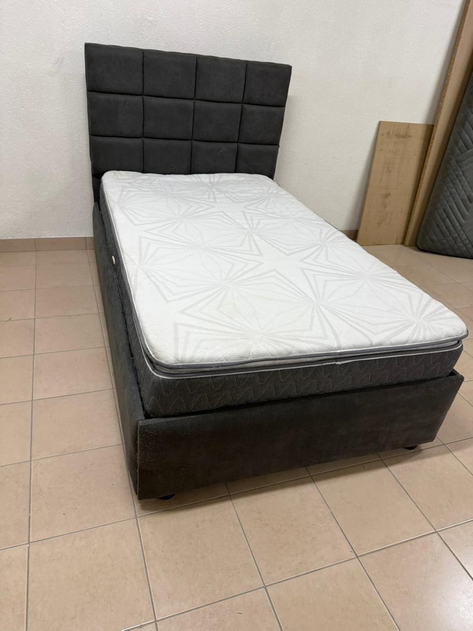 A modern single bed featuring a padded headboard - Image 10