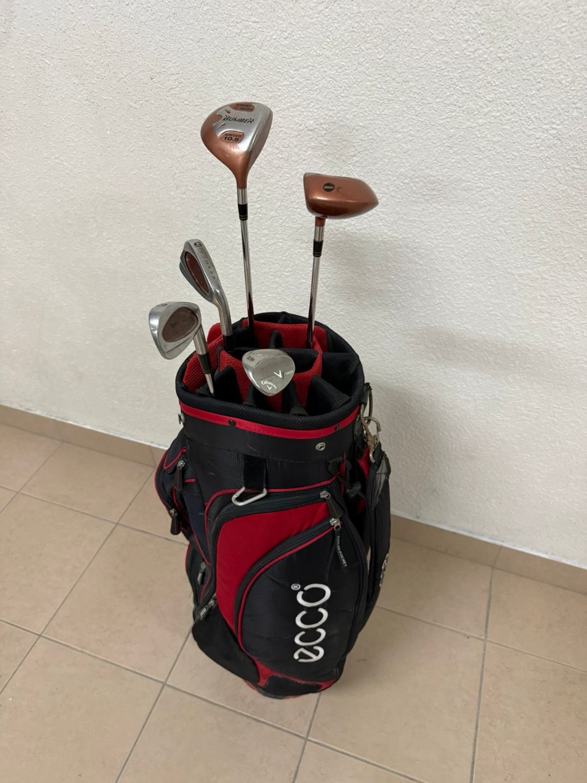 A complete set of golf clubs with a carrying case.