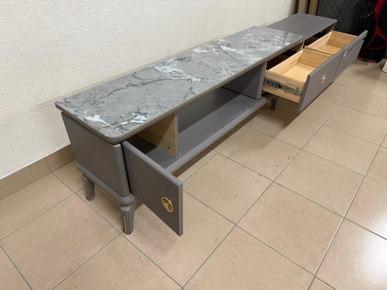 Modern gray extendable TV table with a marble top. - Image 4