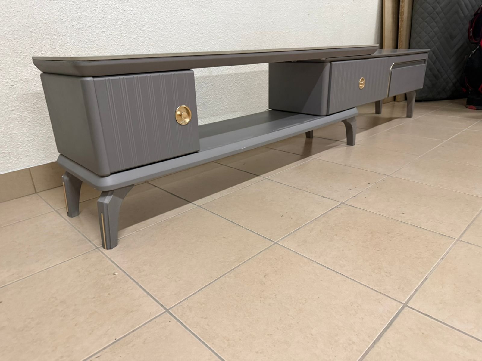 Modern gray extendable TV table with a marble top. - Image 6