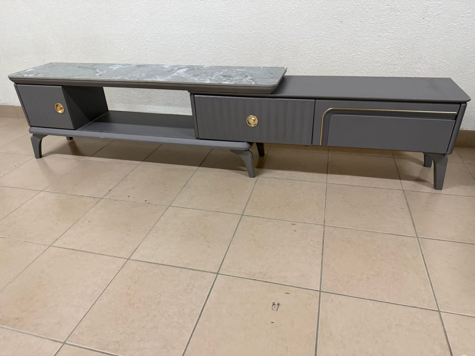 Modern gray extendable TV table with a marble top. - Image 7