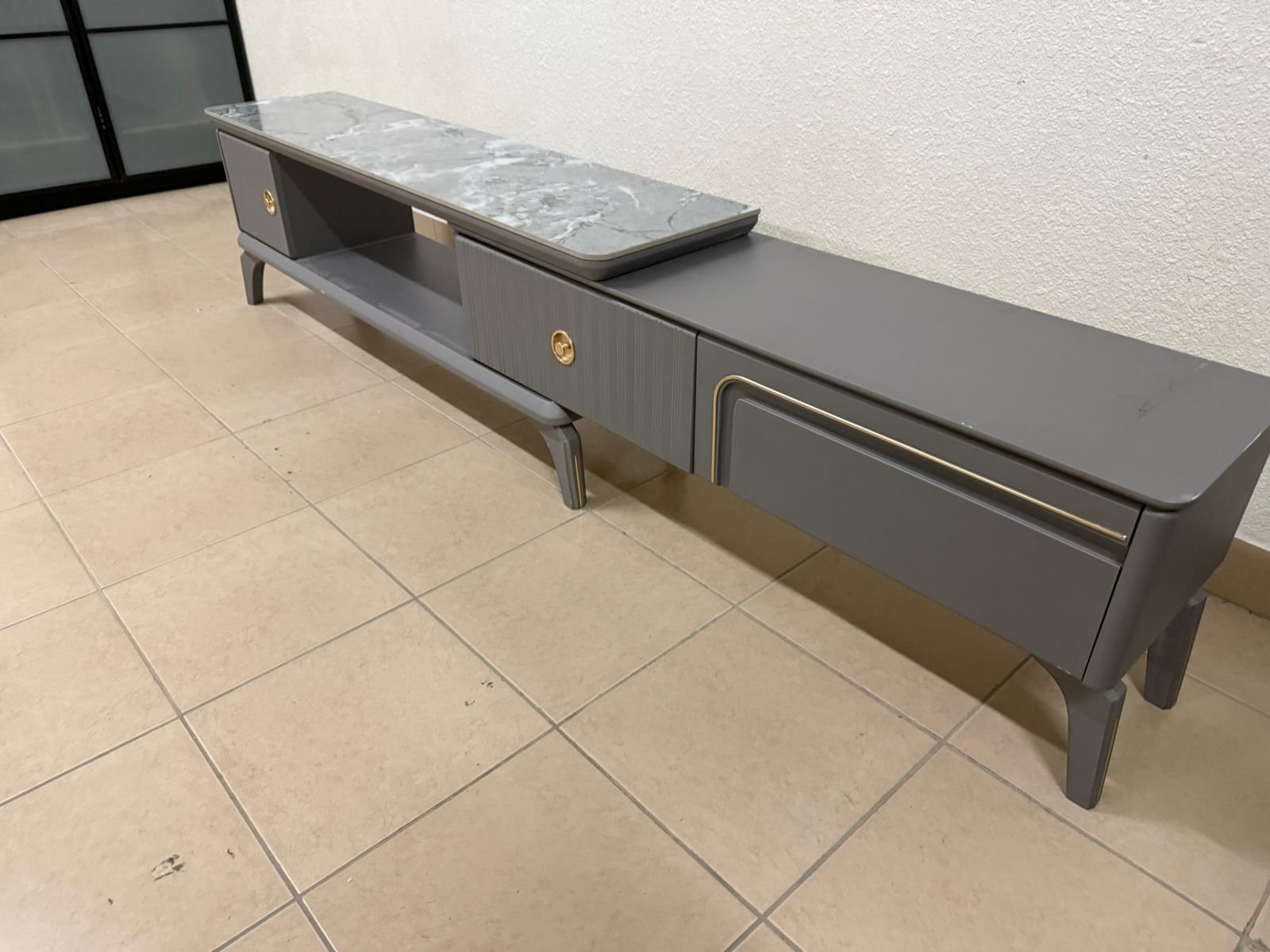 Modern gray extendable TV table with a marble top. - Image 8
