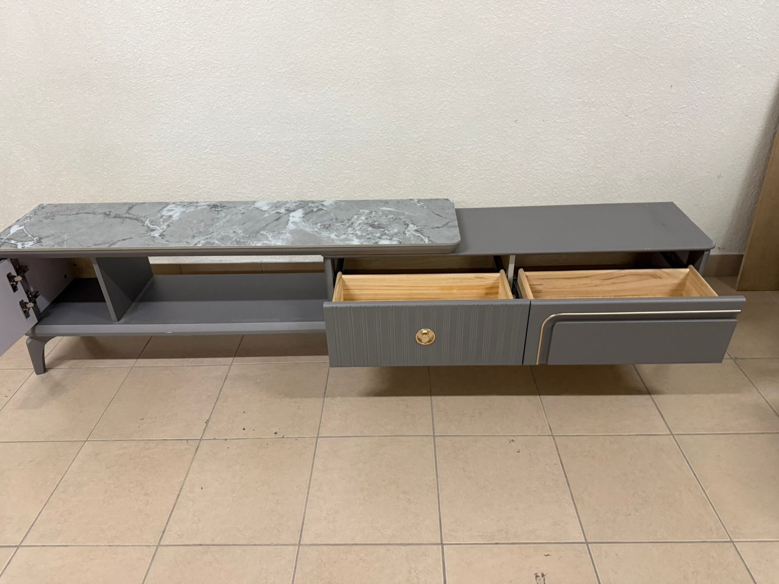 Modern gray extendable TV table with a marble top. - Image 9