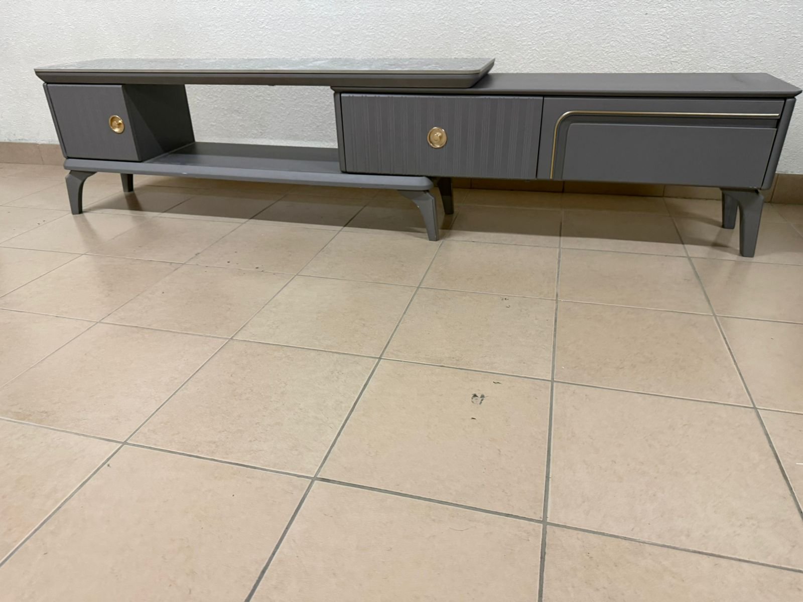 Modern gray extendable TV table with a marble top. - Image 10
