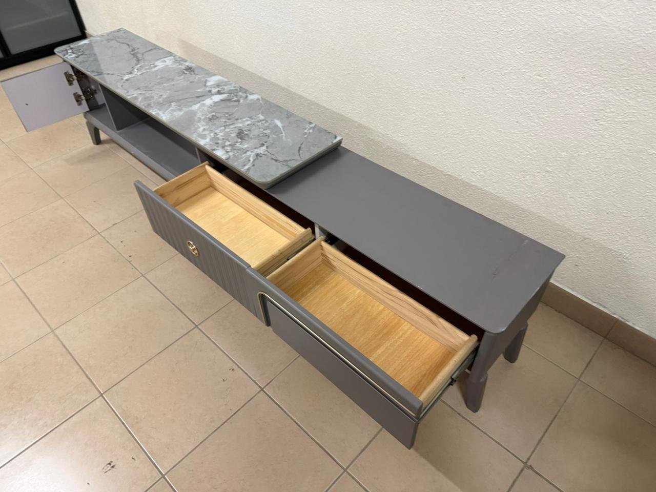 Modern gray extendable TV table with a marble top. - Image 14