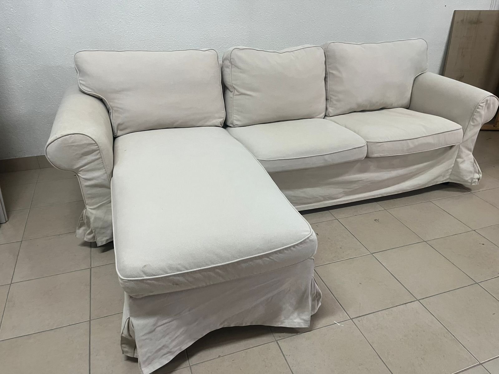 IKEA three-seater sofa with a beige chaise lounge from IKEA