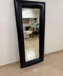 Full-length floor mirror with a black, quilted leather frame