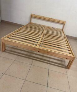 This is an IKEA NEIDEN pine wood bed frame with LÖNSET slatted bed base.