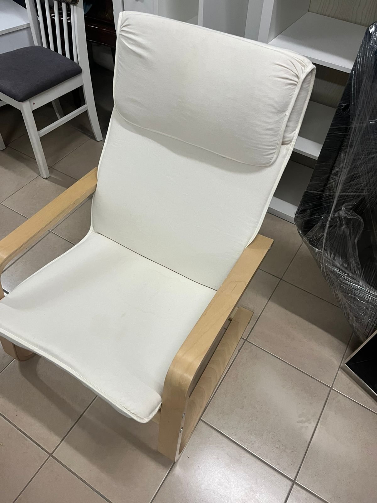 Chair - from IKEA with a natural wood frame and beige cushion - Image 4