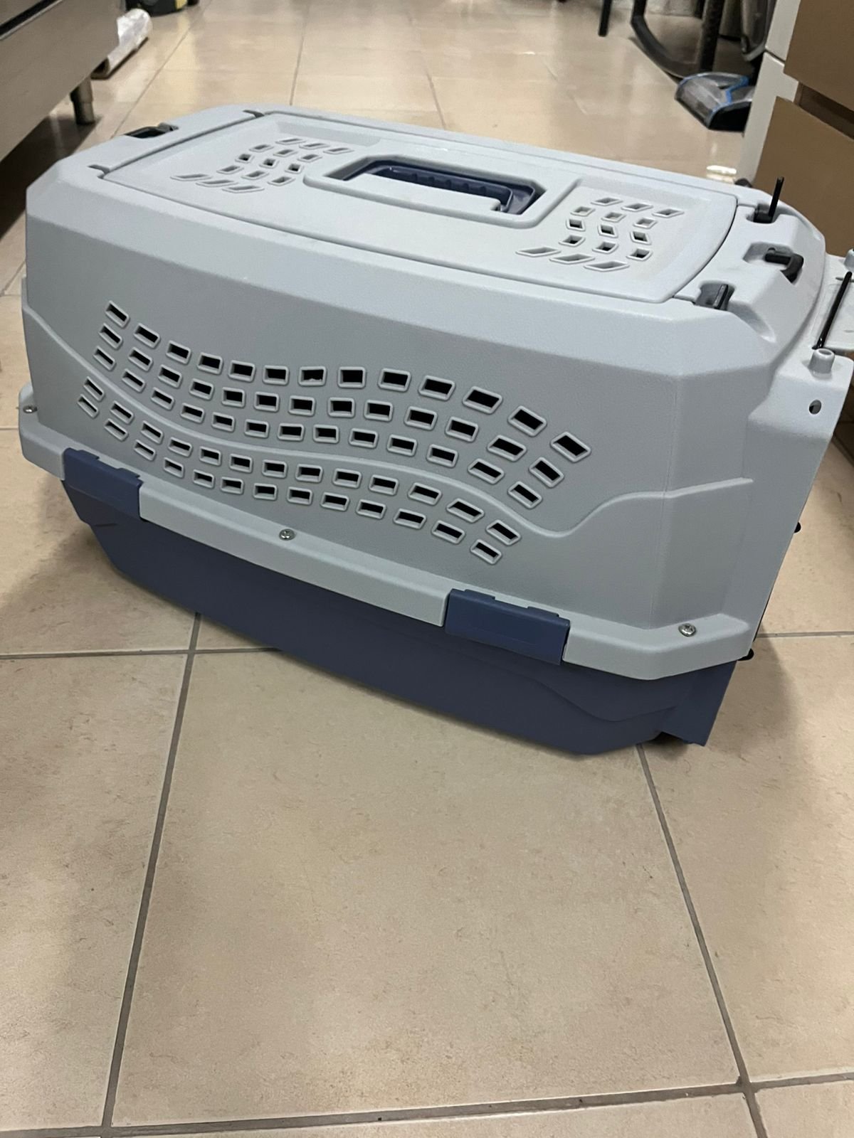 Amazon Basics two-door pet travel bag, featuring a hard design and gray color.