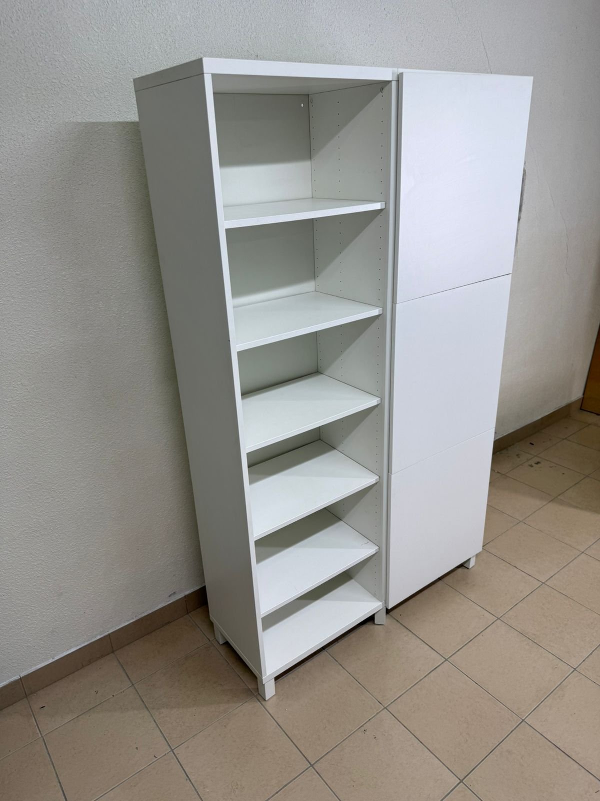 A white storage cabinet from IKEA, model BESTÅ, comes with open units and closed fronts. - Image 2