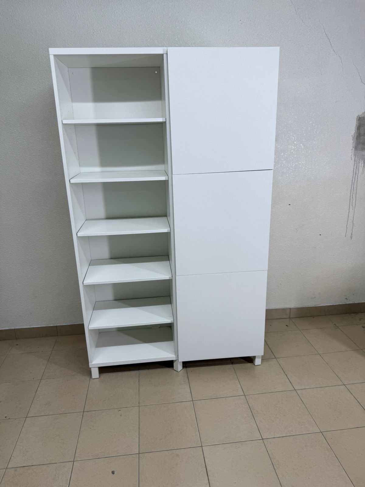 A white storage cabinet from IKEA, model BESTÅ, comes with open units and closed fronts. - Image 5