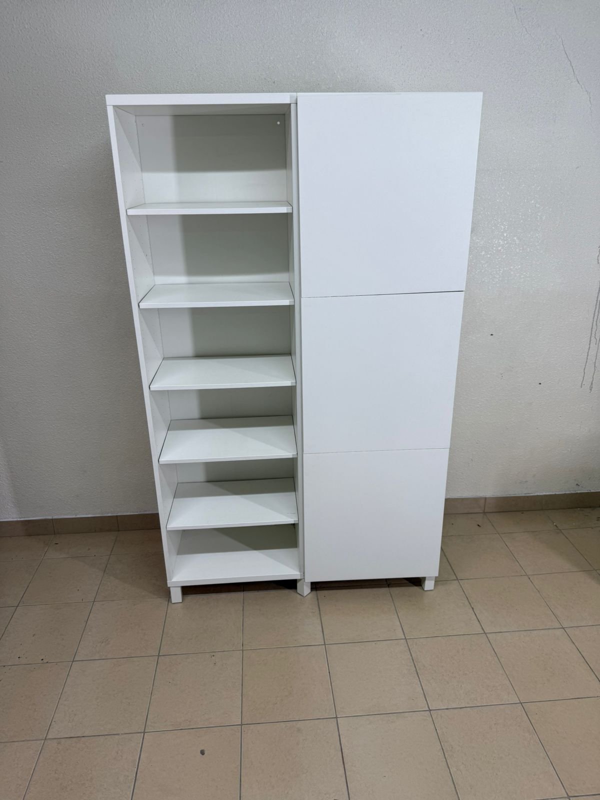 A white storage cabinet from IKEA, model BESTÅ, comes with open units and closed fronts. - Image 6