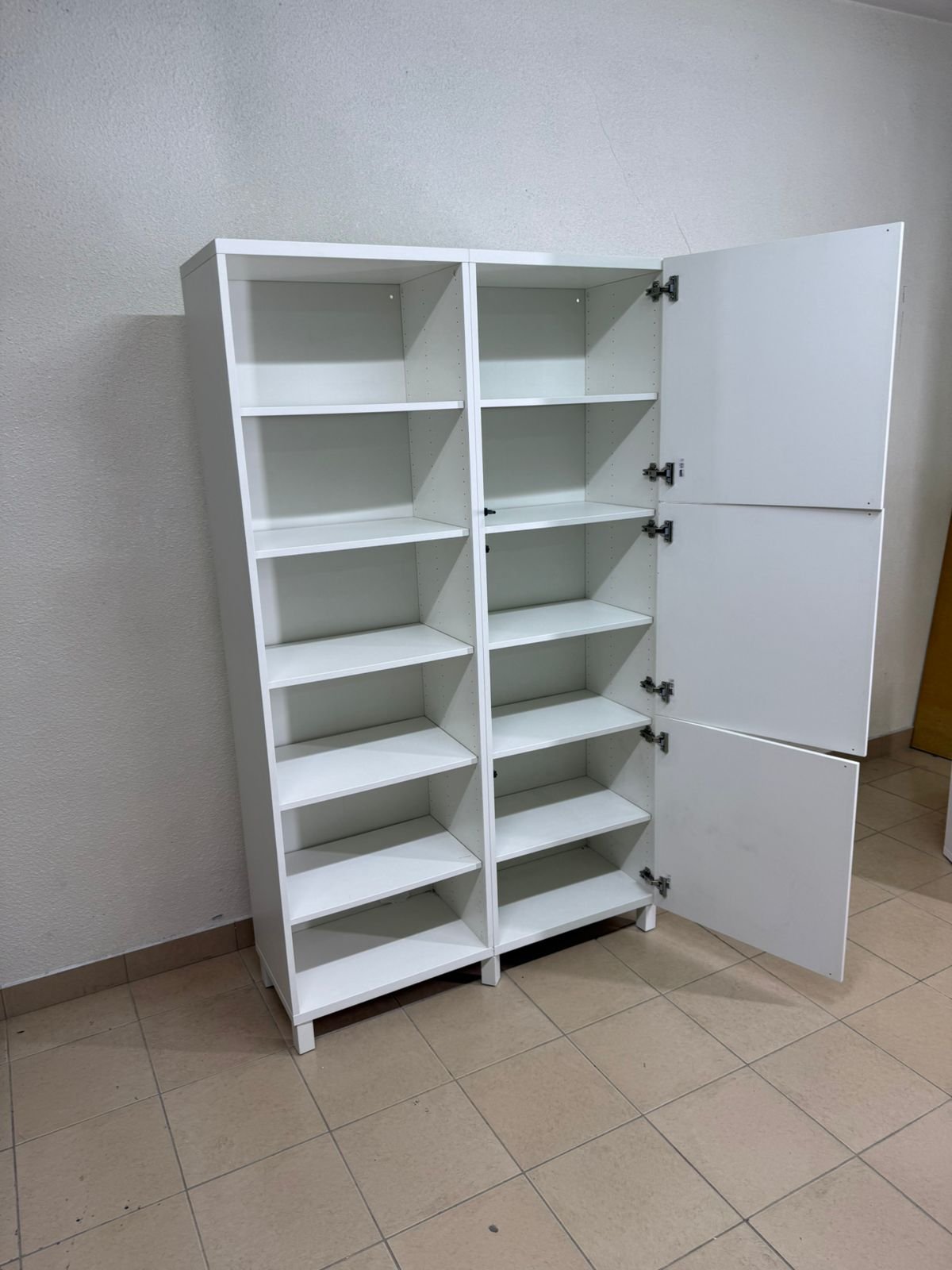 A white storage cabinet from IKEA, model BESTÅ, comes with open units and closed fronts. - Image 8