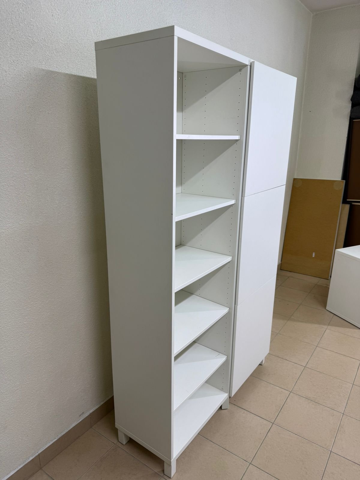 A white storage cabinet from IKEA, model BESTÅ, comes with open units and closed fronts. - Image 10